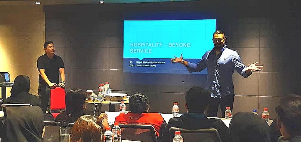 Jayden leading a hospitality training session for TGV Cinemas